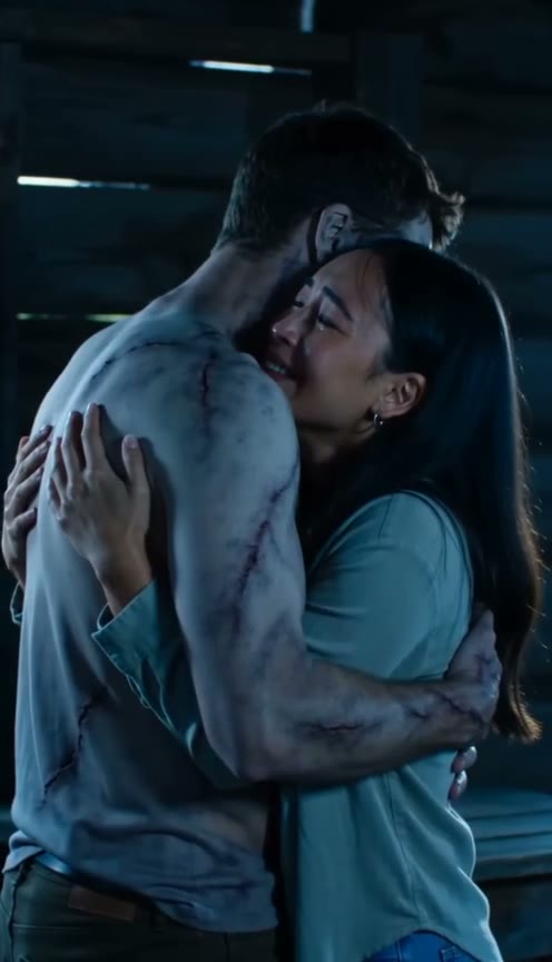 The two partners embrace in the cabin before the memory transition.